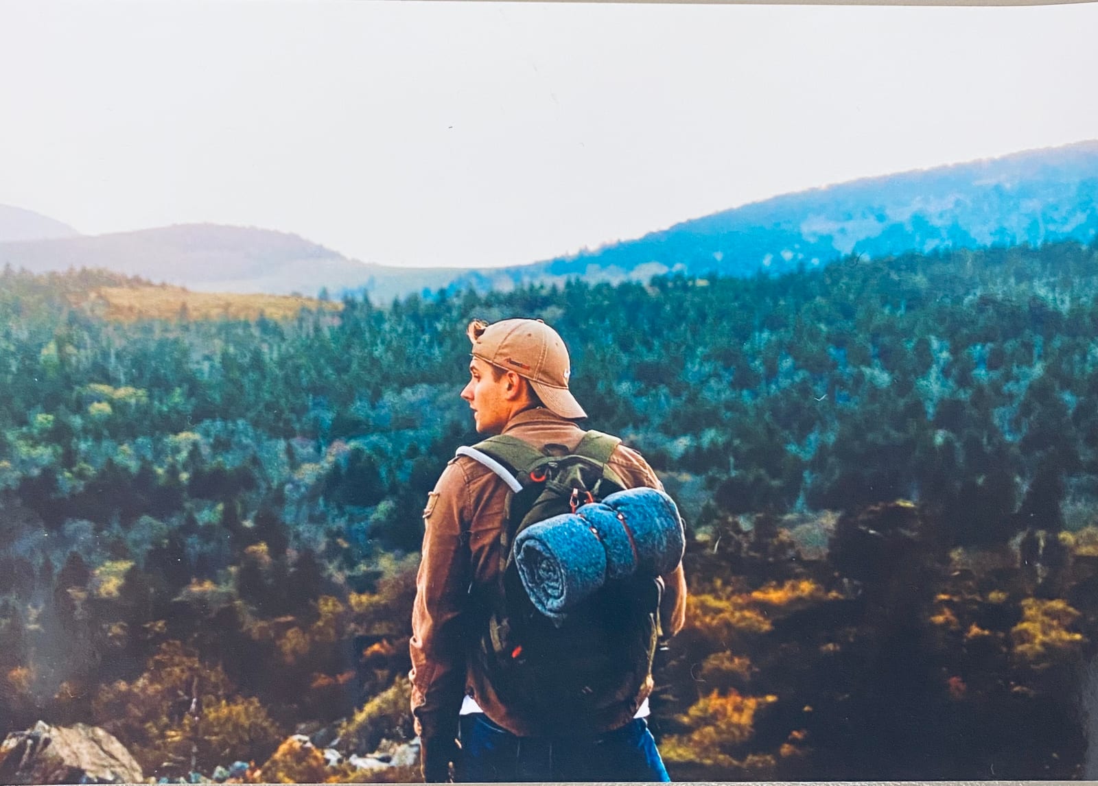 Zach looking across a mountain valley